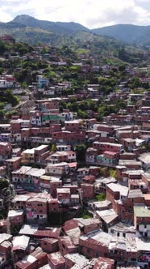 Aerial view of Comuna 13 showing colorful houses in Medellin, Colombia. Dolly Shot