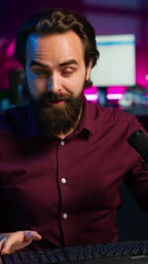 Man Demonstrates Keyboard, Mouse and Headset