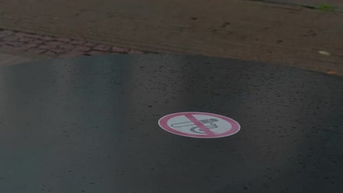 An Urban Scene That Effectively Showcases a Clear No Smoking Sign Placed on a Table Surface in a