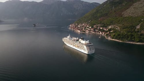 Large cruise ship passing through the picturesque bay of Kotor in Montenegro