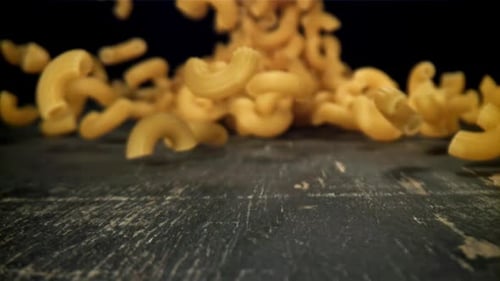 Dry Pasta Falls on the Table Filmed on a Highspeed Camera at 1000 Fps