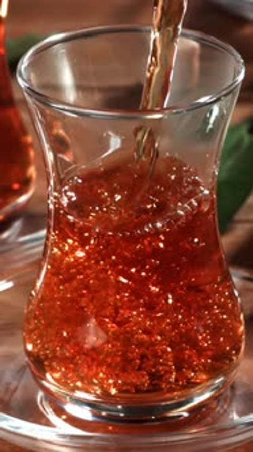 Turkish Tea is Poured Into a Glass Filmed on a Highspeed Camera at 1000 Fps