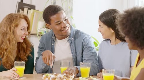 Friends Enjoying Breakfast Together at Home