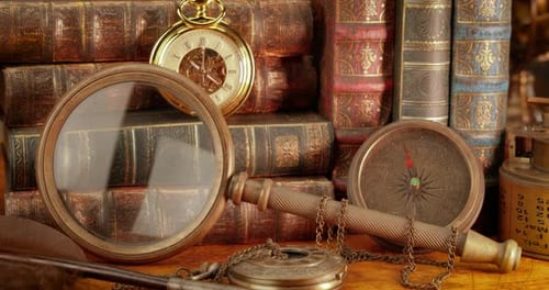 Antique Books, Compass, and Vintage Timepiece