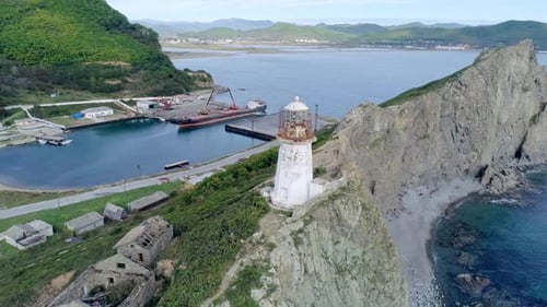 Aerial Orbital View of an Old Lighthouse on the Cliff on Pacific Coast Beautiful Seascape