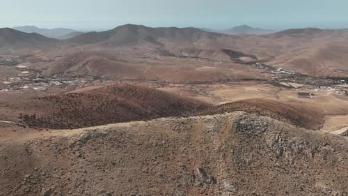 Aerial View of Desert Mountains and Valley Town