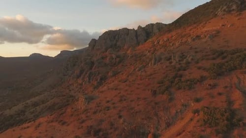 Warm Sunlight Illuminates a Rocky Mountain Range