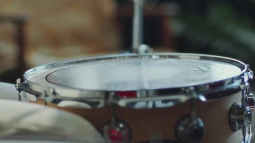 Close-Up of Unrecognizable Drummer Hitting Drum with Sticks