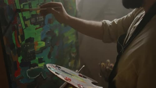 Artist Creating Abstract Painting in the Studio