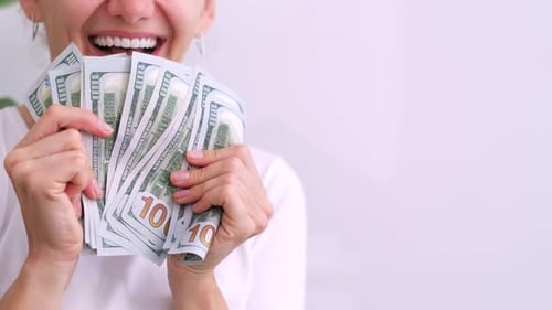 Excited Smiling Woman Showing Cash Money 1000 American Dollars Banknotes Hands with Money Close Up
