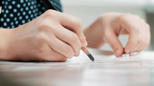 Young Adult Woman Designer Draws Project in Workplace Close Up