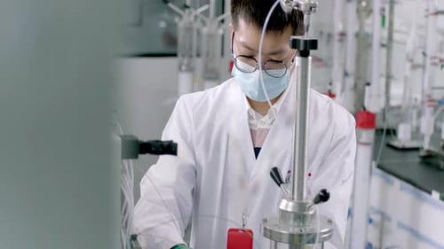 Scientist Working in a Brightly Lit Laboratory