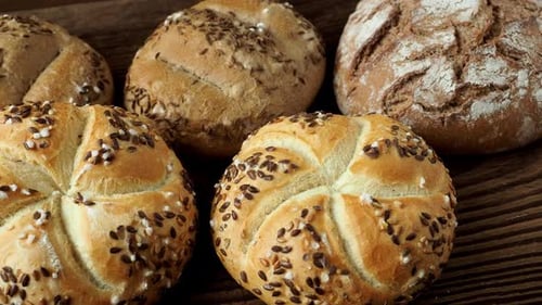 Fresh Bread Rolls on Wooden Surface