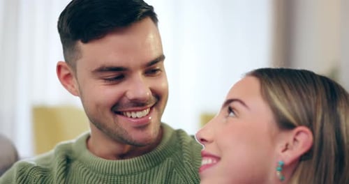 Smiling Couple Talking Together in Interior Setting