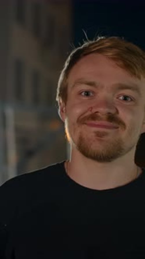 Man Portrait in City at Night Smiling