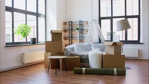 Work and and Real Estate Concept - Loader Takes Out Boxes For