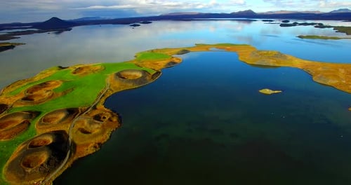 Drone Footage backwards of a volcanoes on a lake in Iceland