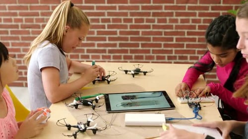 Science students building, testing and designing drones, batteries and electrical equipment