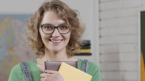 Female Teacher in Glasses in the Classroom Attractive Teachers Face Closeup Portrait of Smart Young