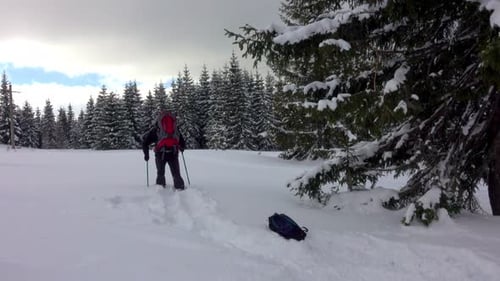 Happy Hiker With Headsets And Backpack Walking In Mountain Winter Forest