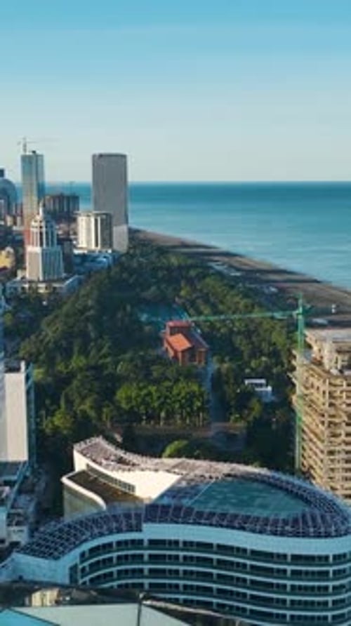 Vertical Video Aerial Marvel Alphabet Tower and Batumi's Black Sea Charm