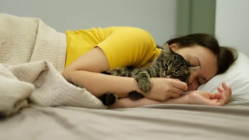 Woman Sleeping Hugging a Cat