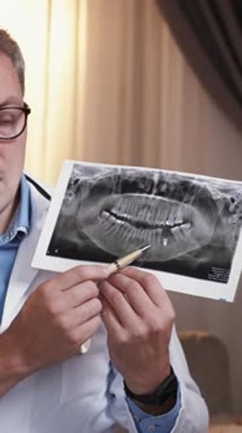 Doctor Explains Dental X-Ray in White Coat