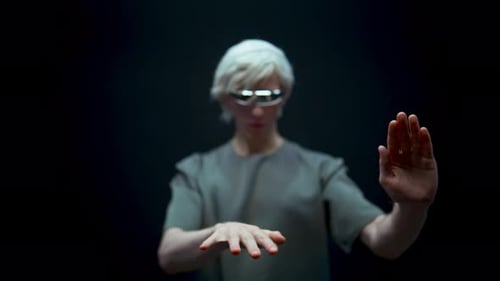 Man with VR Glasses Using Invisible Digital Screen