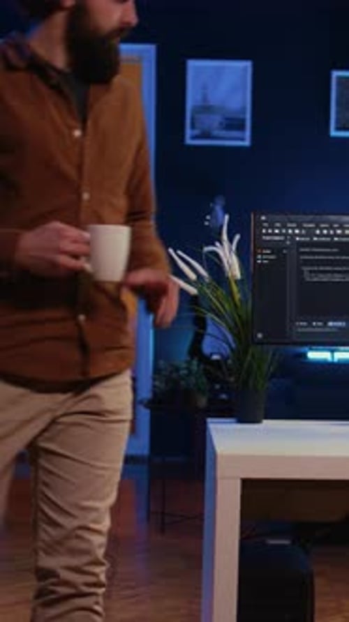 IT Specialist Begins Teleworking Job Shift Holding Cup of Tea