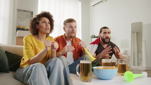 Friends Cheering for Sports Team at Home