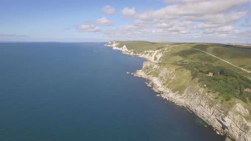 Cornwall aerial drone view of seaside rocky cliffs and turquoise water