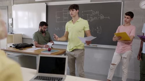 Young Man Gives Presentation in Classroom Setting
