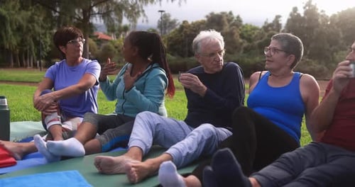 Group of Seniors Chatting After Outdoor Exercise Class