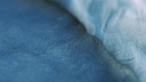 Abstract Light Blue Textured Rippling Surface Background