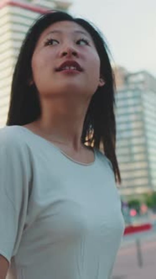 Smiling Woman Walking in the City