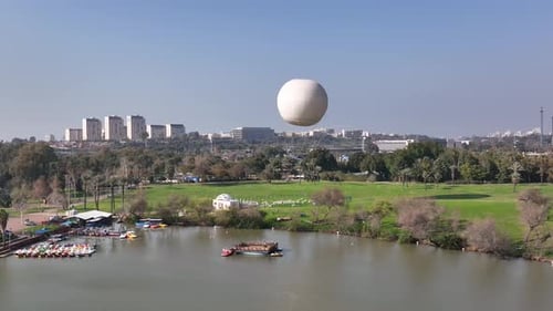 Aerial shot of a hot air balloon over Yarkon Park Tel Aviv, Israel