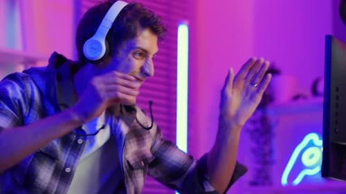 Young Man Excited About Video Game Win