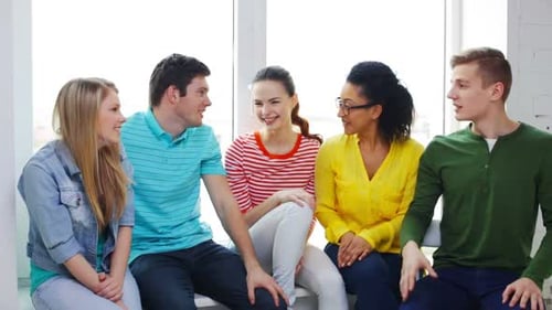 Multiethnic students celebrate teamwork and education success at school