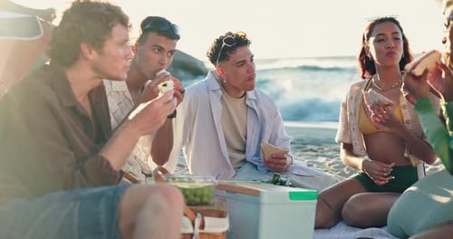 Friends, relax and eating with picnic at beach, holiday or outdoor in summer with conversation