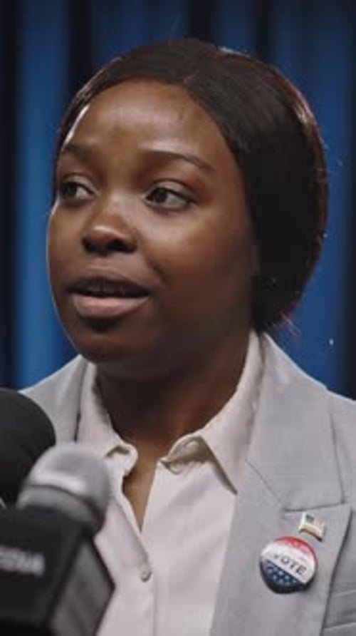 Woman Giving a Statement at a Press Conference