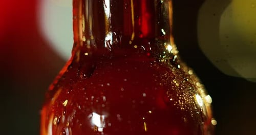 Slow Motion Close Up of cold Beer Bottle