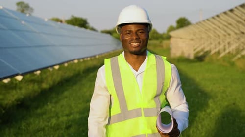 African American Engineer Checking Solar Panels