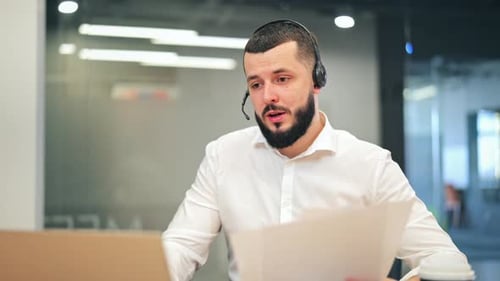 Focused Man Working in Modern Office Environment