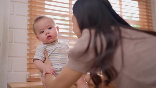 Mother Interacting with Infant at Home