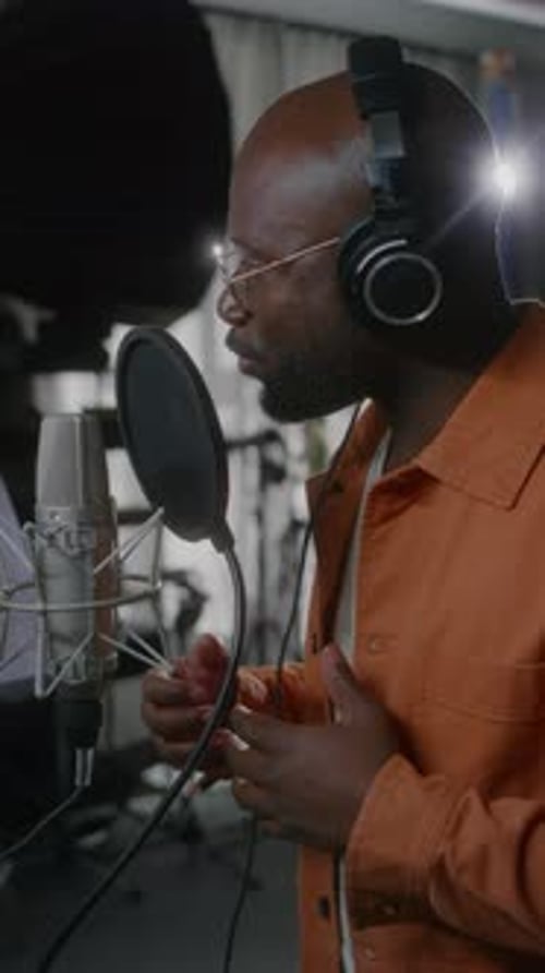African American Male Voice Actor Performing in Recording Studio