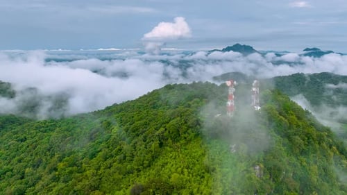 Mist flowing over the summit Above is a telecommunications station.