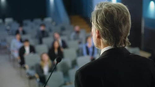 Back View of Politician or Activist Pronouncing Speech During Press Campaign