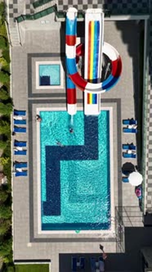 Vertical Video Outdoor Swimming Pool with Exciting Kids Slides and Lively Summer Activities