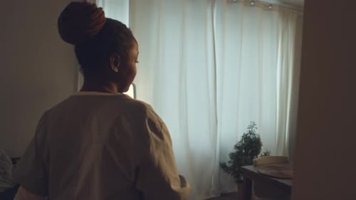 African American Nurse Coming Home after Shift