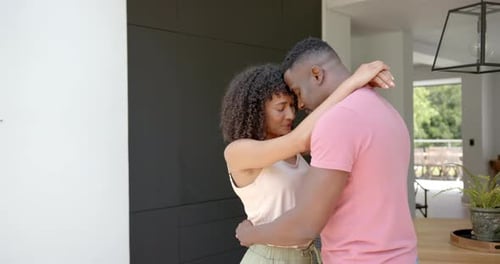 Loving Couple Embrace in Modern Home